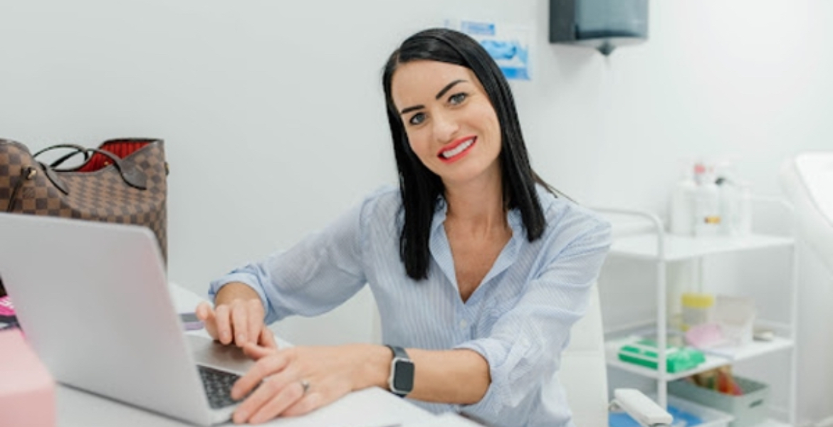 Becky Colwill, Level 7 Advanced Aesthetics Practitioner, at her desk at Aesthetic Medical Ltd